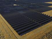 FILE - A solar farm sits in Mona, Utah, Aug. 9, 2022. On Tuesday, Feb. 27, 2024, the Biden administration will announce 17 projects across the U.S. to expand renewable energy access in rural areas, particularly for Native American tribes. The projects, which will cost $366 million, are funded by a $1 trillion infrastructure law President Joe Biden signed in 2021.