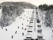 Thanksgiving holiday skiers descend near the North Ridge Quad chairlift Nov. 24 at Killington Ski Resort in Killington, Vt. A new study says U.S. ski areas lost about $5 billion from 2000 to 2019 as a result of human-caused climate change. (Robert F.