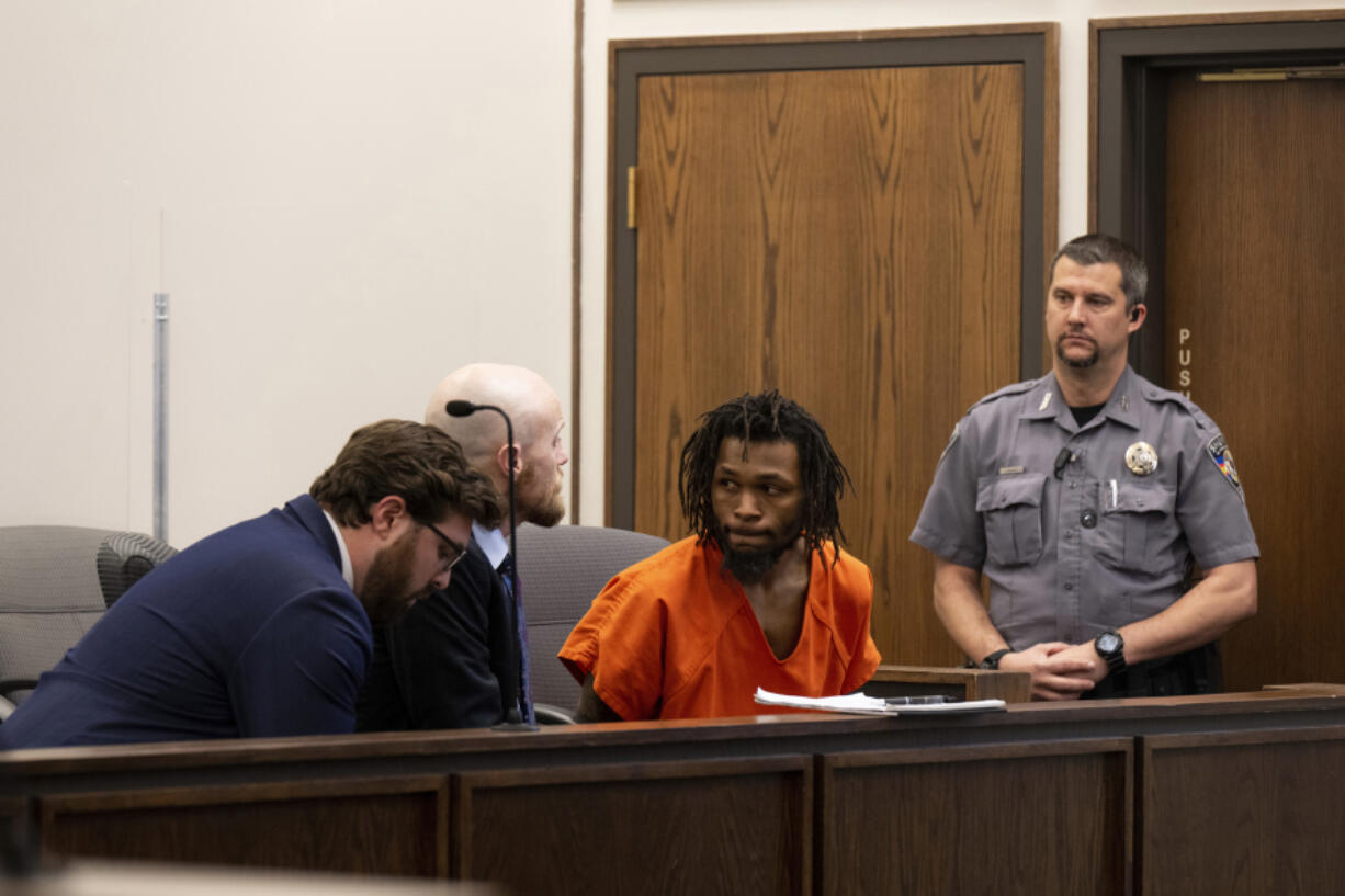 Nicholas Jordan, center right, speaks with his legal counsel during his first appearance at the El Paso County Combined Courts on Friday, Feb. 23, 2024, in Colorado Springs Colo. Jordan was arrested Monday in the deaths of his roommate, 24-year-old, Samuel Knopp, and Celie Rain Montgomery, at the University of Colorado Colorado Springs.