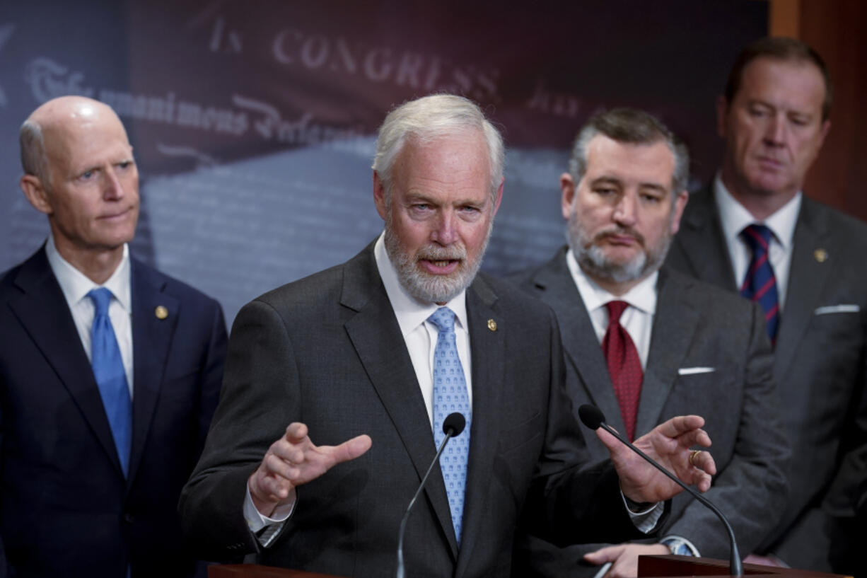 Sen. Ron Johnson, R-Wis., center, is joined by fellow Republicans, from left, Sen. Rick Scott, R-Fla., Sen. Ted Cruz, R-Texas, and Sen. Eric Schmitt, R-Mo., as they criticize the border security bill being negotiated, during a news conference at the Capitol in Washington, Wednesday, Jan. 24, 2024. (AP Photo/J.