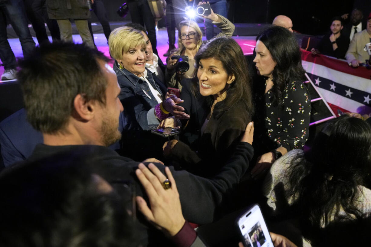 Republican presidential candidate, former UN Ambassador Nikki Haley, center, meets supporters with former Fort Worth, Texas Mayor Betsy Price, left rear, after speaking at a rally in Dallas, Thursday, Feb. 15, 2024.
