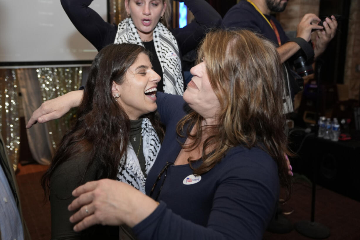 Lexis Zeidan, left, spokesperson for Listen to Michigan, the group running an &ldquo;uncommitted&rdquo; campaign, hugs a supporter during an election night gathering, Tuesday, Feb. 27, 2024, in Dearborn, Mich.  Democrats are closely watching the results of the &ldquo;uncommitted&rdquo; vote, which grassroots organizers have been pushing in Michigan as a way to register objections over Biden&rsquo;s handling of the war in Gaza.