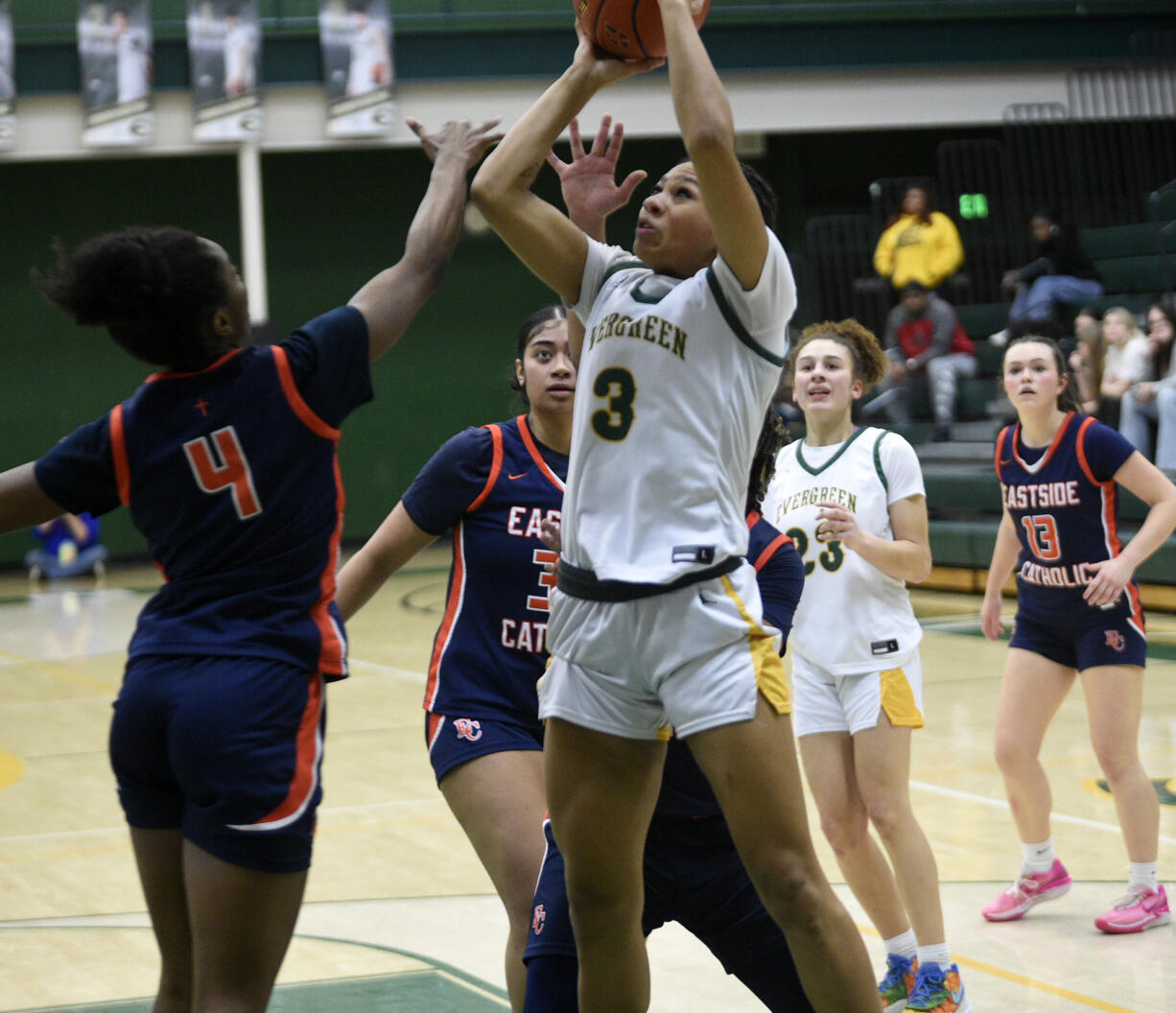 Alexis Echols (3) of Evergreen takes a shot against Linda Nduka (4) of Eastside Catholic in a Class 3A state playoff girls basketball game at Evergreen High School on Tuesday, Feb. 20, 2024.