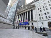 Pedestrians pass the New York Stock Exchange on Tuesday, Feb. 20, 2024 in New York.