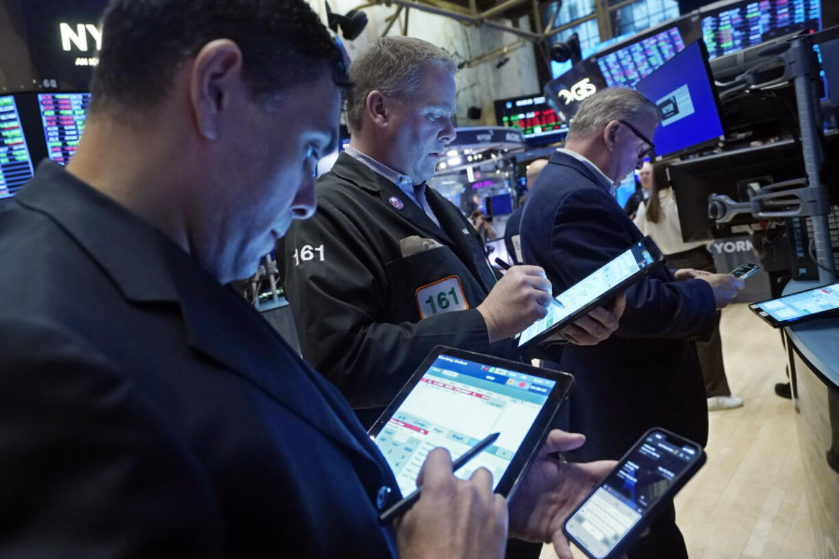 Traders work on the floor of the New York Stock Exchange, Wednesday, Jan. 31, 2024. Technology stocks are slumping Wednesday as several of Wall Street&rsquo;s most influential stocks feel the downside of ultrahigh expectations.