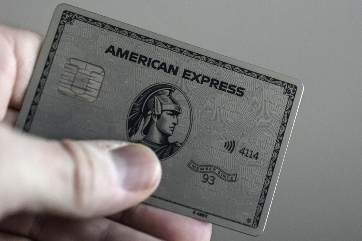 An American Express card is shown, Thursday, Jan. 18, 2024, in Atlanta. A combination of inflation, increased interest rates, and the end of pandemic-tied relief, such as the moratorium on student loan payments, has led to record credit card debt, experts say.