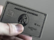 An American Express card is shown, Thursday, Jan. 18, 2024, in Atlanta. A combination of inflation, increased interest rates, and the end of pandemic-tied relief, such as the moratorium on student loan payments, has led to record credit card debt, experts say.