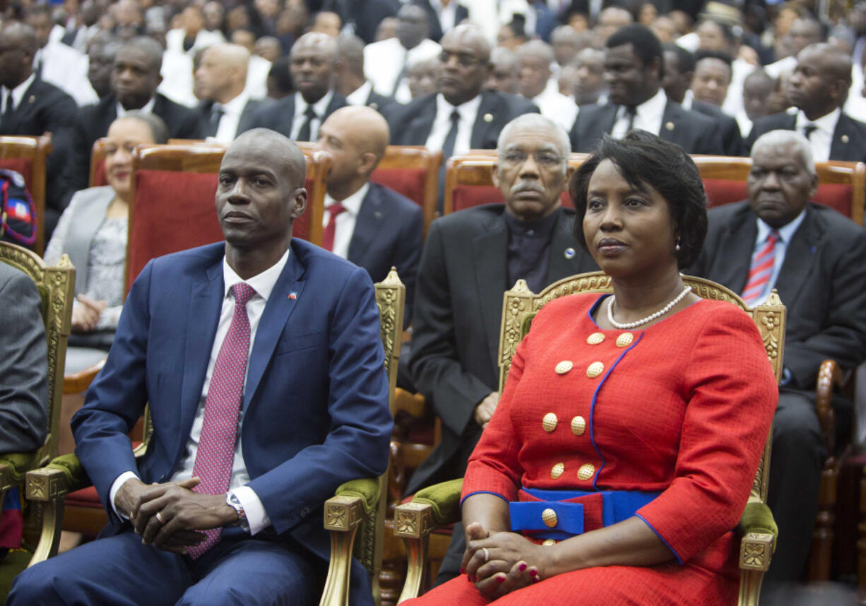 FILE  Haiti&rsquo;s President Jovenel Moise sits with his wife Martine during his swearing-in ceremony at Parliament in Port-au-Prince, Haiti, Tuesday Feb. 7, 2017. A judge investigating the July 2021 assassination of President Mo&iuml;se issued a final report on Monday, Feb. 19, 2024, that indicts his widow, Martine Mo&iuml;se, ex-prime minister Claude Joseph and the former chief of Haiti&rsquo;s National Police, L&eacute;on Charles, among others.