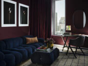 A San Francisco living room done by interiors firm frenchCalifornia features this stylish space painted in Backdrop&rsquo;s Lobby Scene, a dark, warm purple-red that was inspired by Wes Anderson&rsquo;s The Grand Budapest Hotel and the color of the lobby boy&rsquo;s uniform.