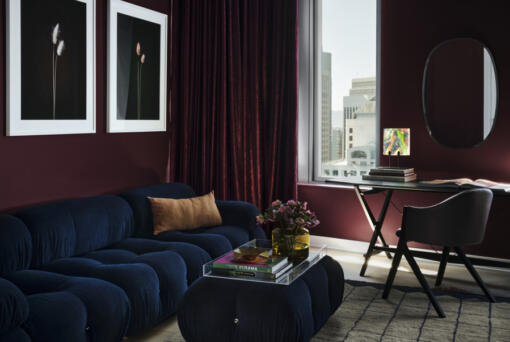 A San Francisco living room done by interiors firm frenchCalifornia features this stylish space painted in Backdrop&rsquo;s Lobby Scene, a dark, warm purple-red that was inspired by Wes Anderson&rsquo;s The Grand Budapest Hotel and the color of the lobby boy&rsquo;s uniform.