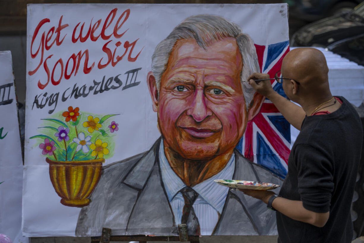 An artist from Gurukul art school makes a painting of Britain&rsquo;s King Charles III wishing him speedy recovery Tuesday in Mumbai, India. Buckingham Palace announced Monday evening that the king has begun outpatient treatment for an undisclosed form of cancer.