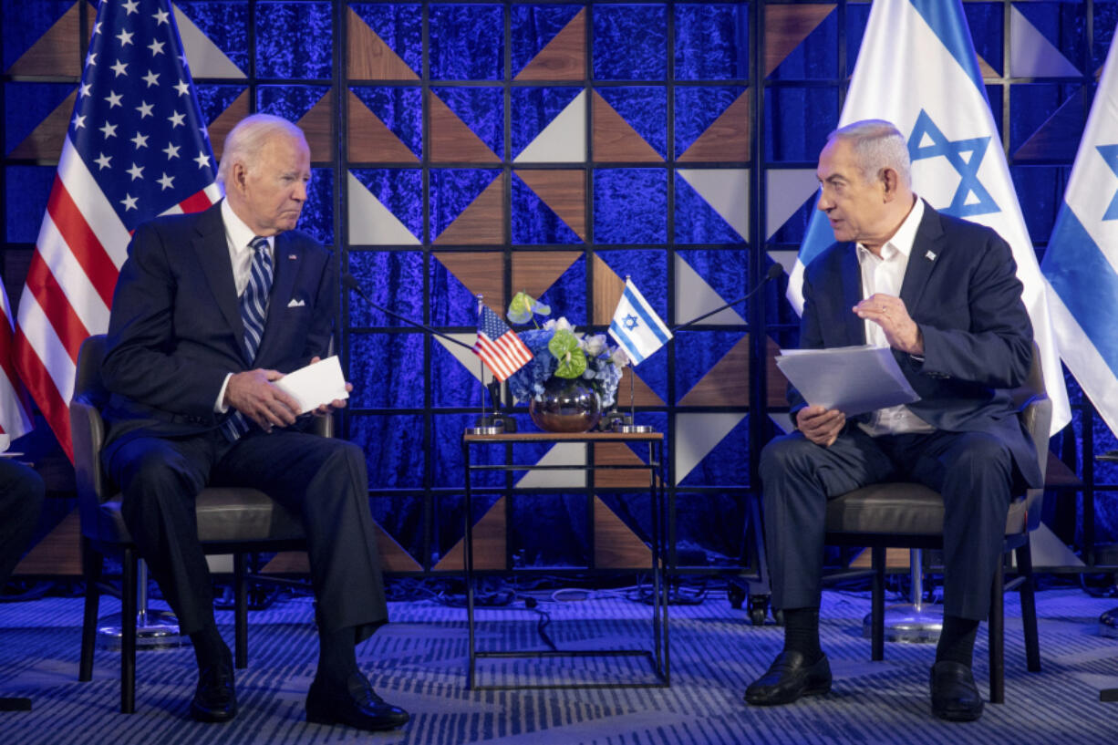 FILE - U.S. President Joe Biden, left, meets with Israeli Prime Minister Benjamin Netanyahu, right, to discuss the the war between Israel and Hamas, in Tel Aviv, Israel, on Oct. 18, 2023. U.S. and Mideast mediators appeared optimistic in recent days that they are closing in on a deal for a two-month cease-fire in Gaza and the release of over 100 hostages held by Hamas. But on Tuesday, Israeli Prime Minister Netanyahu rejected the militant group&rsquo;s two main demands &mdash; that Israel withdraw its forces from Gaza and release thousands of Palestinian prisoners &mdash; indicating that the gap between the two sides remains wide.