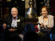 FILE- Former President Jimmy Carter and his wife former First Lady Rosalynn Carter sit together during a reception to celebrate their 75th anniversary Saturday, July 10, 2021, in Plains, Ga. In the year since Jimmy Carter first entered home hospice care, the 39th president has celebrated his 99th birthday, enjoyed tributes to his legacy and outlived his wife of 77 years. Rosalynn Carter, who died in November 2023 after suffering from dementia, spent just a few days under hospice.