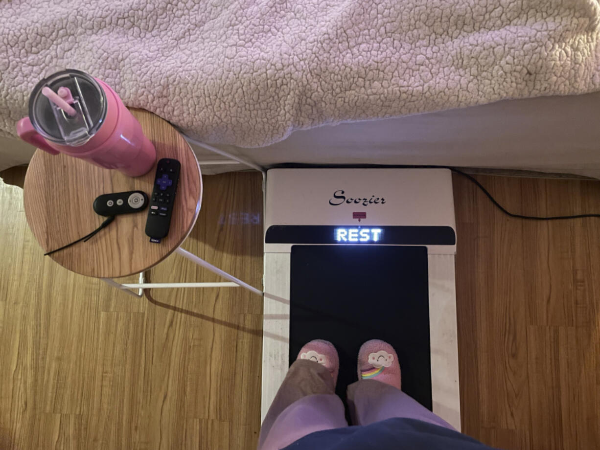 Hope Zuckerbrow, founder of the cozy cardio wellness movement, shows her workout set-up, including a walking pad, smoothie and remote control for watching television.