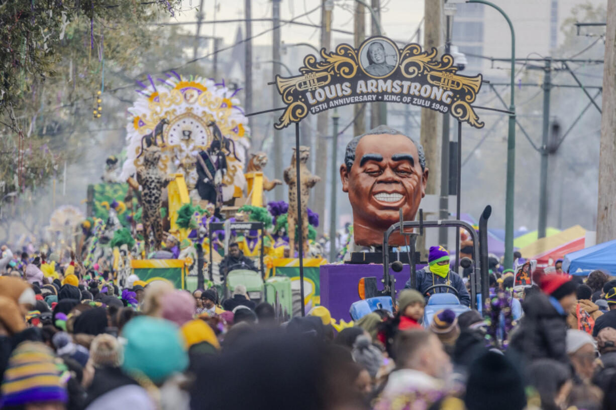 A float featuring Louis Armstrong leads the way in the Zulu parade on Mardi Gras in New Orleans on Tuesday.