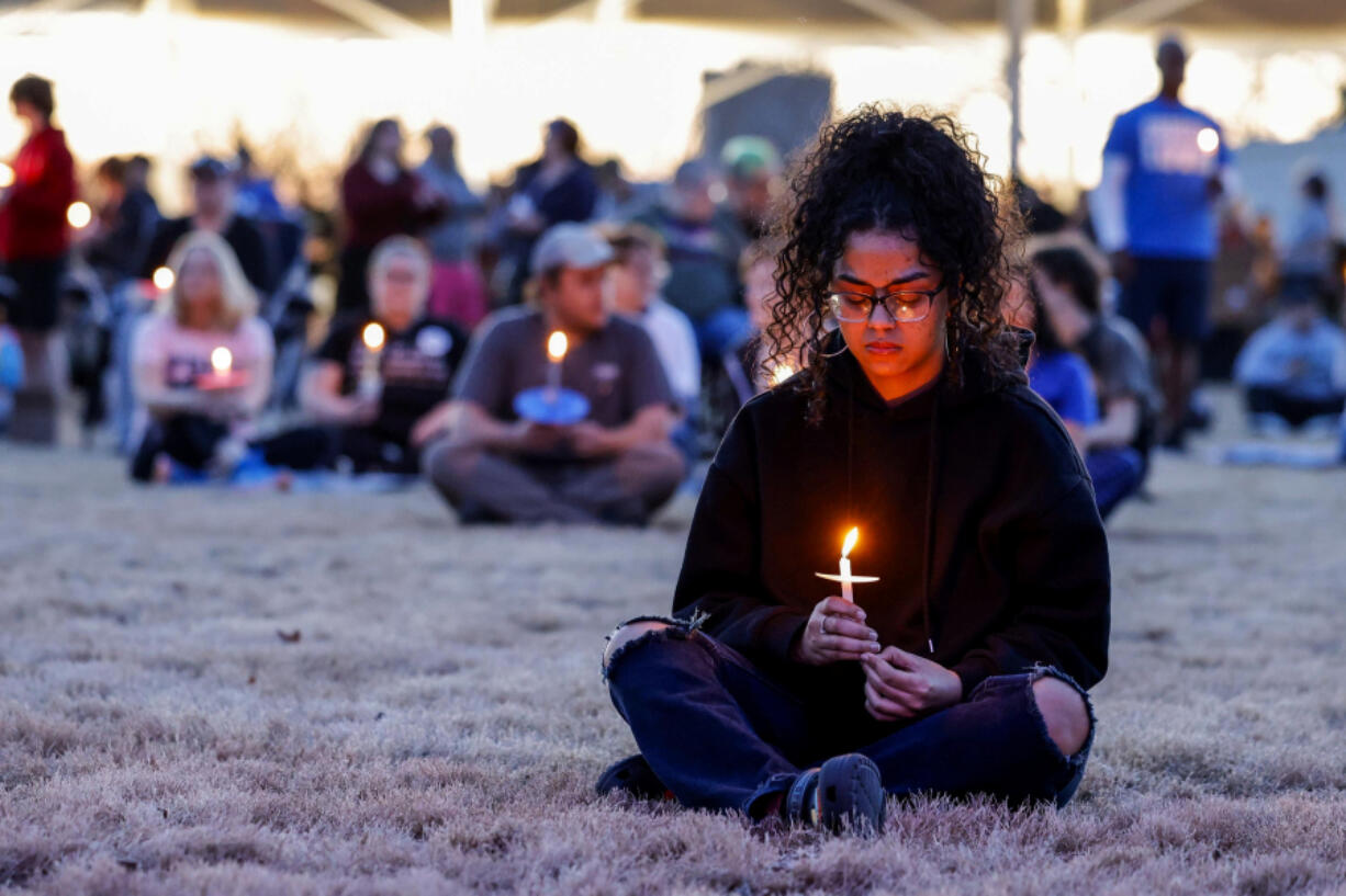 Desha Love participates in a community candlelight vigil for Nex Benedict, an Oklahoma teenager who died the day after a fight in a high school bathroom in which the nonbinary student said they were a target of bullying, Sunday, Feb. 25, 2024, in Owasso, Okla.