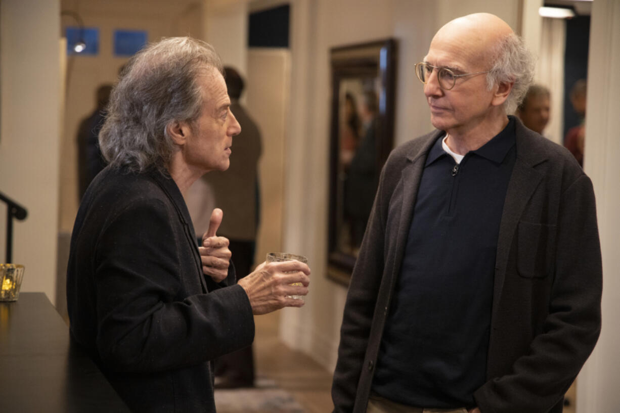 This image released by HBO shows Richard Lewis, left, with Larry David in a scene from Season 10 of &ldquo;Curb Your Enthusiasm.&rdquo; Lewis, an acclaimed comedian known for exploring his neuroses in frantic, stream-of-consciousness diatribes while dressed in all-black, leading to his nickname &ldquo;The Prince of Pain,&rdquo; has died. He was 76. He died at his home in Los Angeles on Tuesday night after suffering a heart attack, according to his publicist Jeff Abraham. (John P.