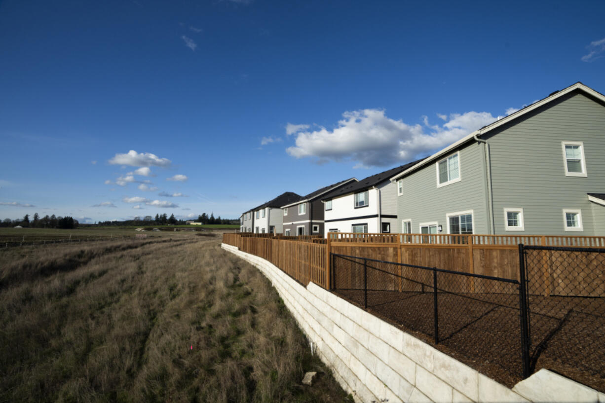 Homes in the southwest Portland suburb of Beaverton, Ore., line the urban growth boundary on Thursday. Such boundaries were established in 1973 to prevent urban sprawl and preserve nature and farmland in Oregon.