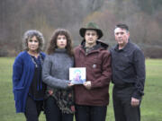 In this undated image provided by Haylee Wendling, family members of Colin Conner pose for a photo as they hold an image of Colin. Conner, who struggled with opioid addiction for years, lost his life to a fentanyl overdose in June 2023, just days after being released from a Salt Lake City jail. Conner&#039;s father said the jail had discontinued his methadone prescription, causing him to go through agonizing withdrawal and prompting cravings to return while he was behind bars.