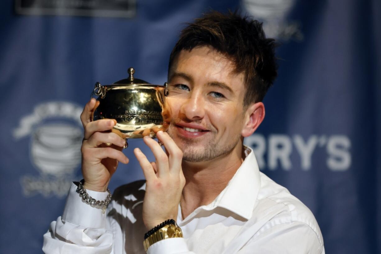 Harvard University&#039;s Hasty Pudding Theatricals Man of the Year Barry Keoghan holds the Pudding Pot during a news conference following a roast, Friday, Feb. 2, 2024, in Cambridge, Mass.