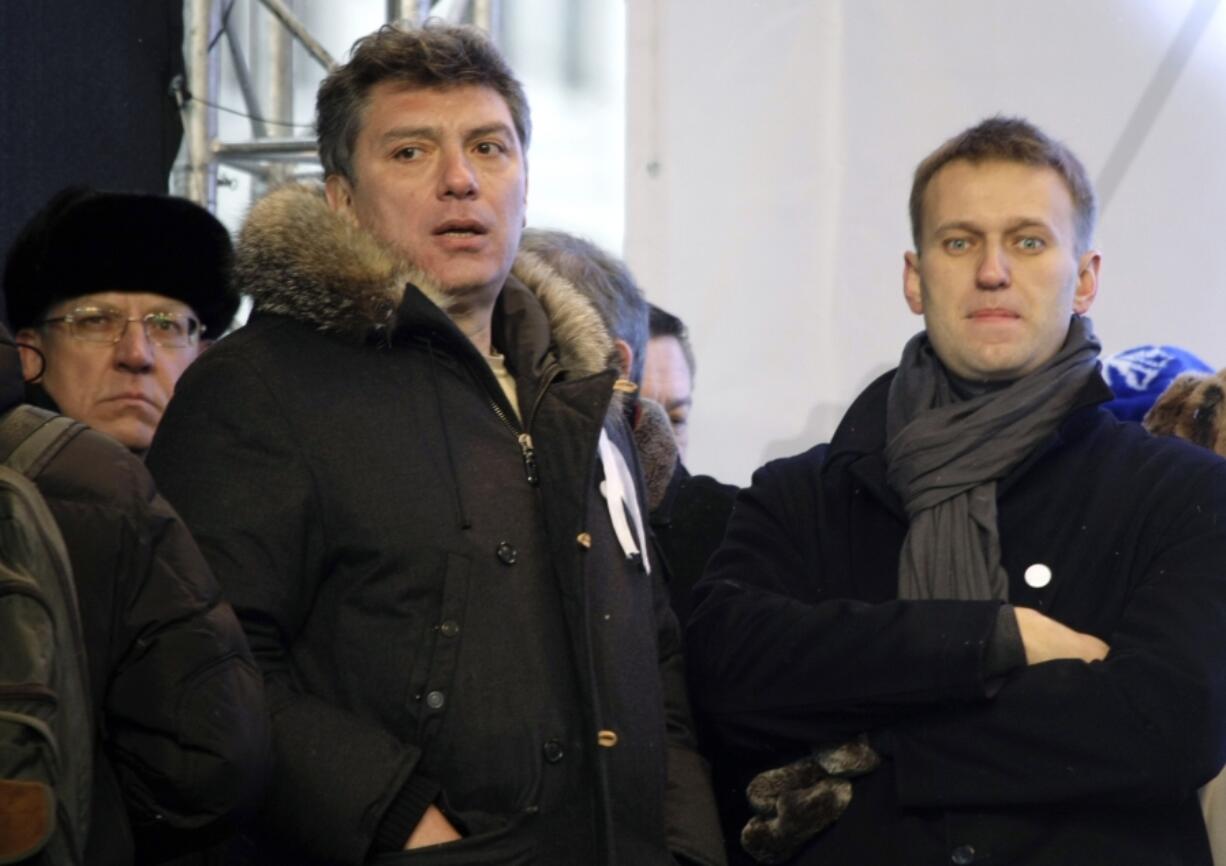 FILE - From left, Russian former Financial Minister Alexei Kudrin, leaders of the opposition Boris Nemtsov and Alexei Navalny attend a rally to protest alleged vote rigging in Russia&#039;s parliamentary elections on Sakharov avenue in Moscow, Russia on Dec. 24, 2011. Russia&rsquo;s prison agency says that imprisoned opposition leader Alexei Navalny has died. He was 47. The Federal Prison Service said in a statement that Navalny felt unwell after a walk on Friday Feb. 16, 2024 and lost consciousness.