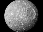 Saturn&rsquo;s moon Mimas and it&rsquo;s large Herschel Crater, is captured by the Cassini spacecraft. .
