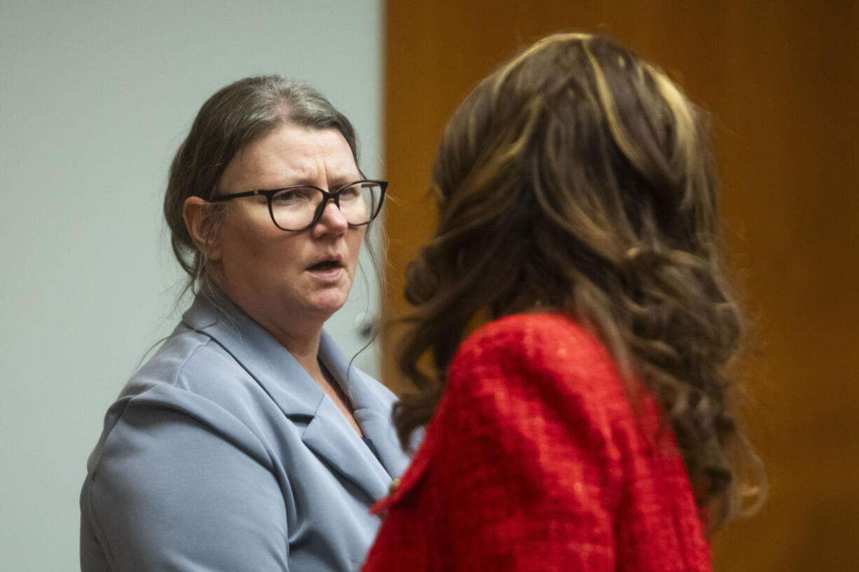 Defendant Jennifer Crumbley, left, speaks with her attorney during her jury trial at the Oakland County Courthouse on Wednesday, Jan. 31, 2024, in Pontiac, Mich. Jennifer Crumbley is charged with involuntary manslaughter for gross negligence in connection with her son Ethan Crumbley who shot and killed four classmates at Oxford High School in November 2021. James Crumbley, Ethan&rsquo;s father, is also charged with involuntary manslaughter but will be tried separately.