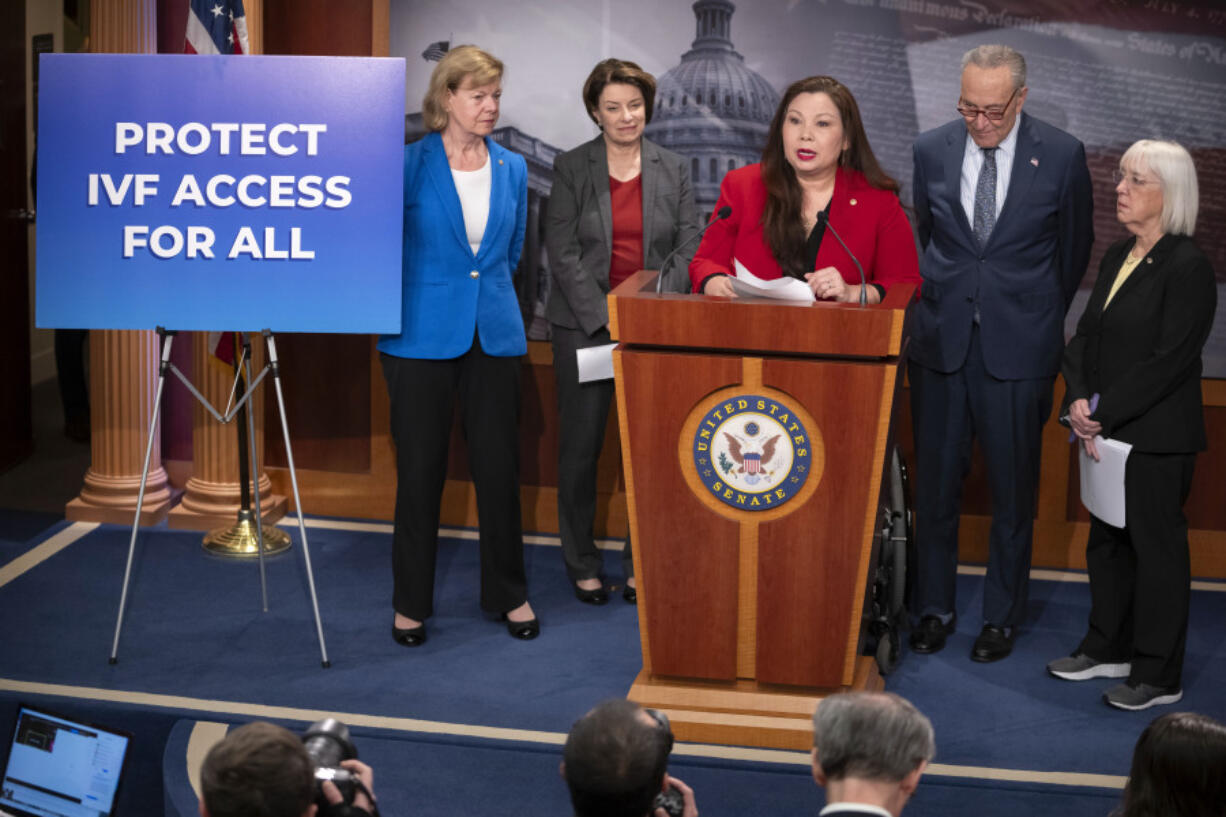 Sen. Tammy Duckworth, D-Ill., center, speaks about a bill to establish federal protections for IVF as, from left, Sen. Tammy Baldwin, D-Wis., Sen. Amy Klobuchar, D-Minn., Senate Majority Leader Chuck Schumer of N.Y., and Sen. Patty Murray, D-Wash., listen during a press event on Capitol Hill, Tuesday, Feb. 27, 2024, in Washington.