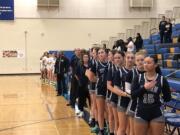Kiera Parks (15) and the Skyview girls basketball team stand for the national anthem before a District 3-4 tournament game against Kentwood on Thursday, Feb. 15, 2024 at Stadium High School in Tacoma.