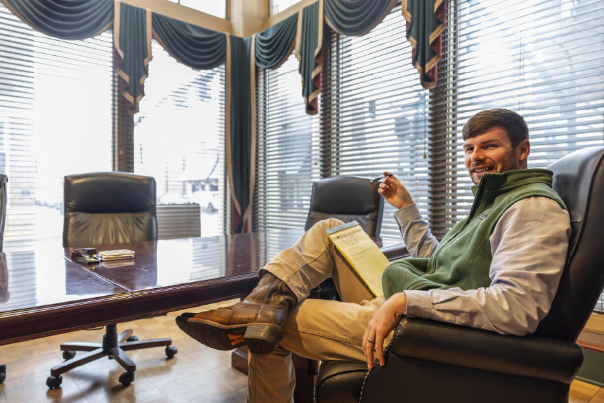 Hunter Garnett, of Garnett Patterson Injury Lawyers, sits Jan. 25 at his law office near the Madison County courthouse in Huntsville, Ala. Garnett is seeking a smaller office space in the suburbs closer to his clients, rather than the large space he has now.