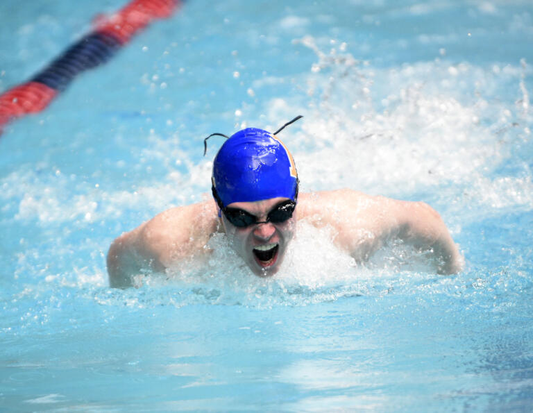 Aiden Jensen swims the butterfly leg in the 200 medley relay for Ridgefield at the 2A boys swimming state championship meet at the King County Aquatic Center in Federal Way on Saturday, Feb. 17, 2024.