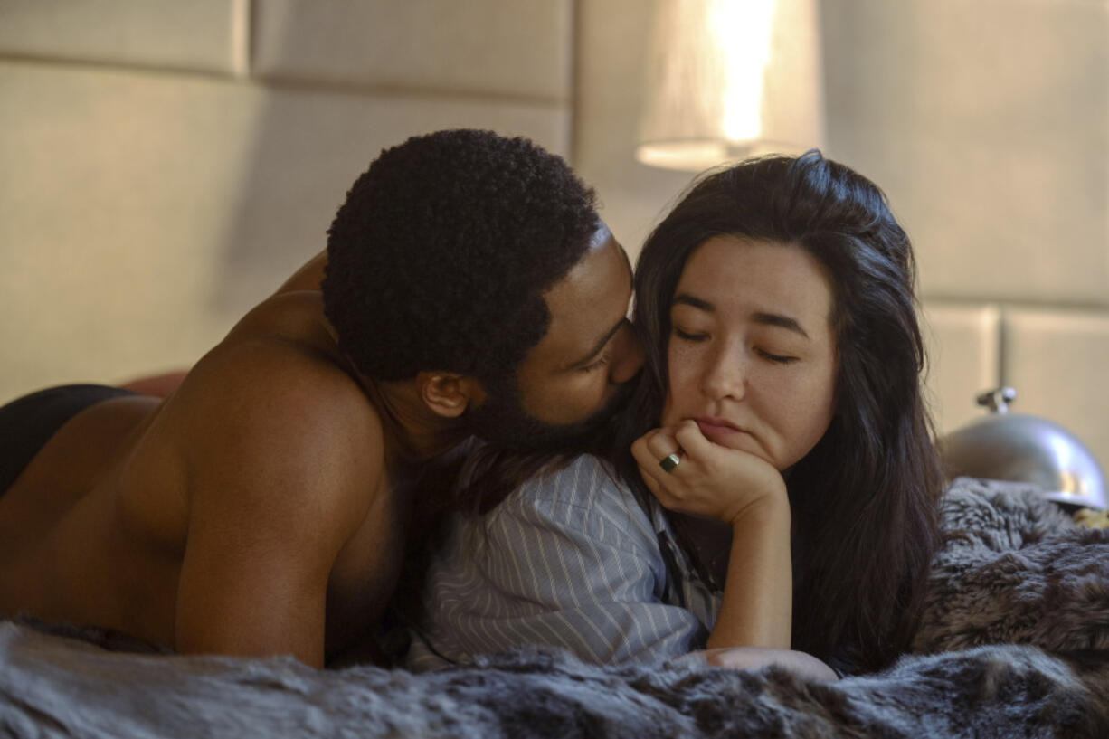 This image released by Prime Video shows Donald Glover, left, and Maya Erskine in a scene from the series &ldquo;Mr. &amp; Mrs. Smith,&rdquo; premiering Feb. 2 on Prime Video.