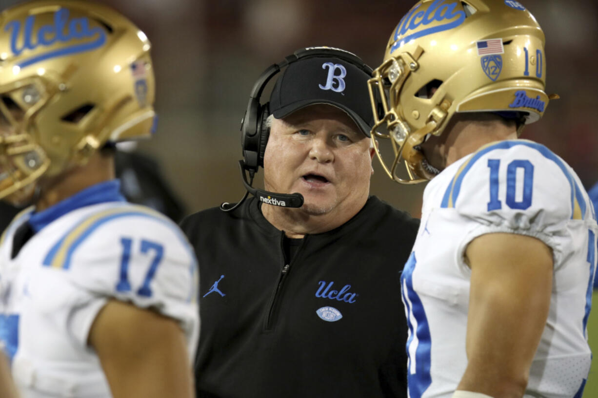 FILE - UCLA head coach Chip Kelly stands on the sideline during an NCAA college football game against Stanford, Saturday, Oct. 21, 2023, in Stanford, Calif. Chip Kelly has informed UCLA officials that he is stepping down as coach of the Bruins, a person with direct knowledge of the decision told The Associated Press on Friday, Feb.