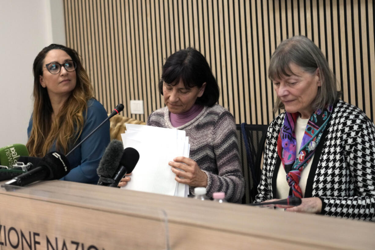 Gloria Branciani, center, is flanked by lawyer Laura Sgro, left, and Mirjam Kovac, former member of the Loyola community of sisters co-founded by Father Marko Rupnik, during a press conference in Rome, Wednesday, Feb. 21, 2024. Gloria Branciani, 59, is one of the first women who accused Rev. Marko Rupnik, a once-exalted Jesuit artist of spiritual, psychological and sexual abuse. Gloria Branciani went public Wednesday to demand transparency from the Vatican and a full accounting of the hierarchs who covered Rupnik for 30 years.