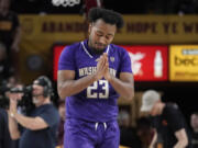 Washington guard Anthony Holland (23) gestures after their 84-82 overtime win against Arizona State during an NCAA college basketball game Thursday, Feb. 22, 2024, in Tempe, Ariz.