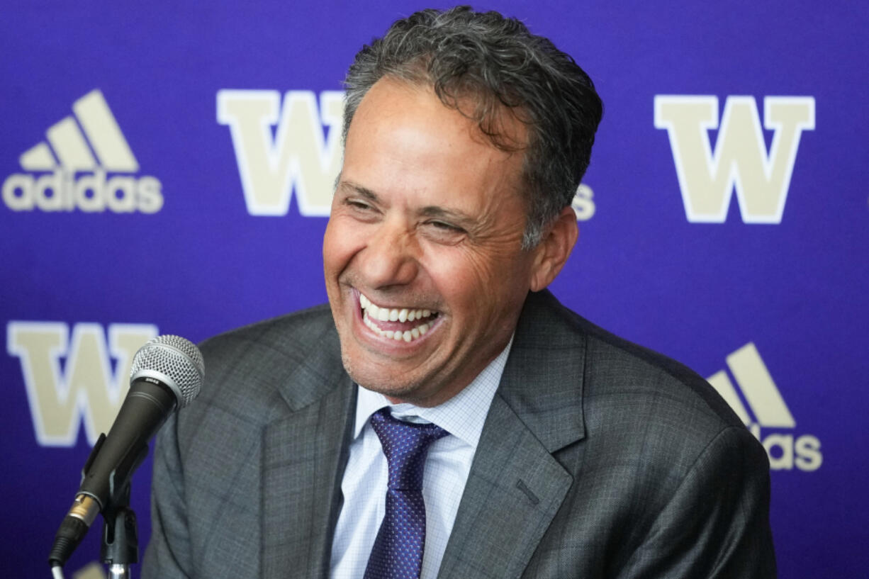 New Washington head coach Jedd Fisch laughs during an NCAA college football press conference to introduce him to the community, Tuesday, Jan. 16, 2024, in Seattle.