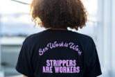 Andrea, no last name given, who works as a stripper in Seattle area clubs, poses for a portrait at her apartment, Thursday, Feb. 1, 2024, in Seattle. Andrea is among those fighting for bills to pass in the state Legislature that would expand statewide protections to workers, like having a security guard at each club, keypad codes to enter dressing rooms and de-escalation training.