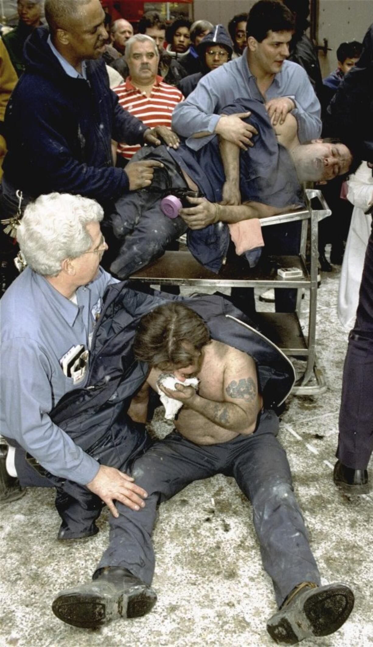 FILE - Victims of a fire at the World Trade Center in New York are treated at the scene, Feb. 26, 1993. New York City is marking the anniversary of the 1993 bombing that blew apart a van parked in an underground garage, killing six people and injured more than 1,000. The Port Authority of New York and New Jersey is holding a memorial Mass on Monday, Feb. 26, 2024 at St. Peter&rsquo;s Church in Manhattan.