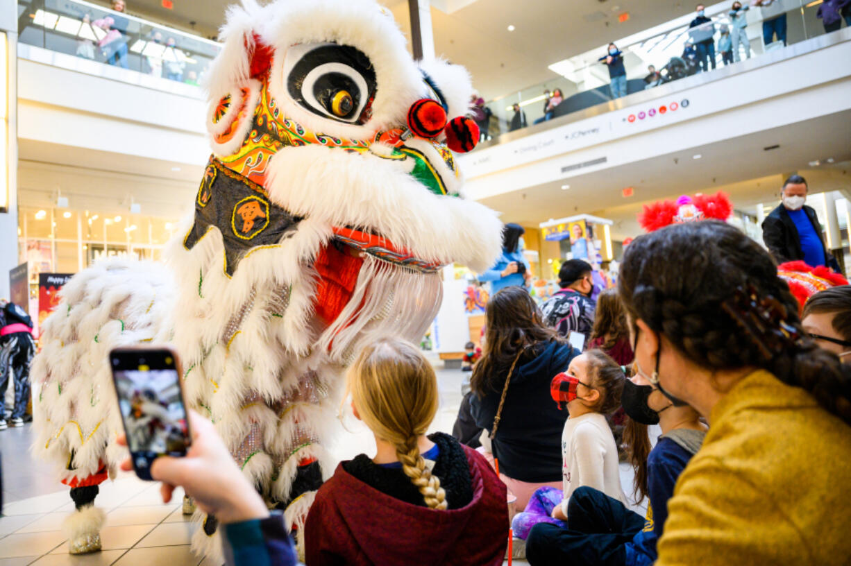 The White Lotus dance group performs a lion dance at Vancouver Mall to celebrate Lunar New Year in 2022. Lion dances are performed to chase away evil spirits and welcome prosperity and luck for the new year. (Molly J.