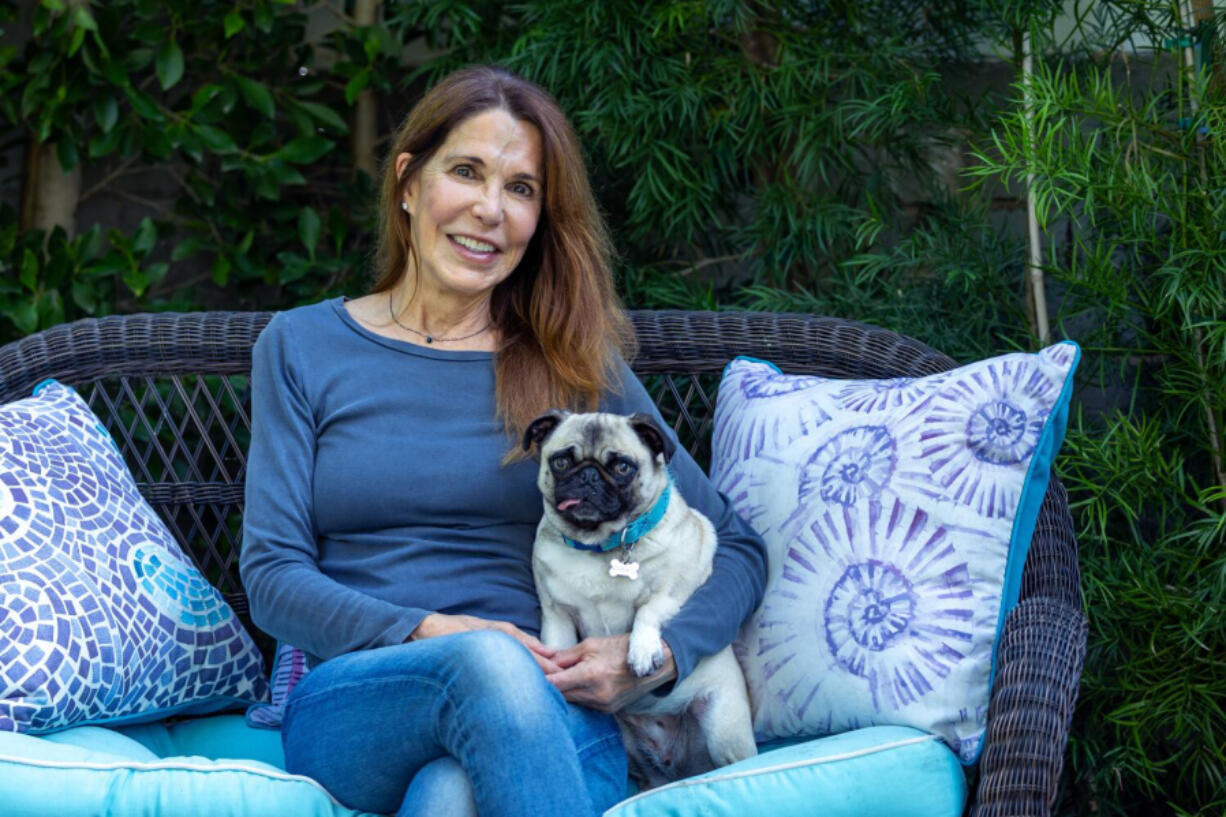 Patti Davis sits for a portrait with her pug, Lily, at her home on Jan. 18 in Santa Monica, Calif. Davis, an author, former rebel and sometimes-outspoken opponent of the policies put forth by her own father - President Ronald Reagan - has a new memoir out, &ldquo;Dear Mom and Dad,&rdquo; that covers her complicated relationship with her powerful, famous family.