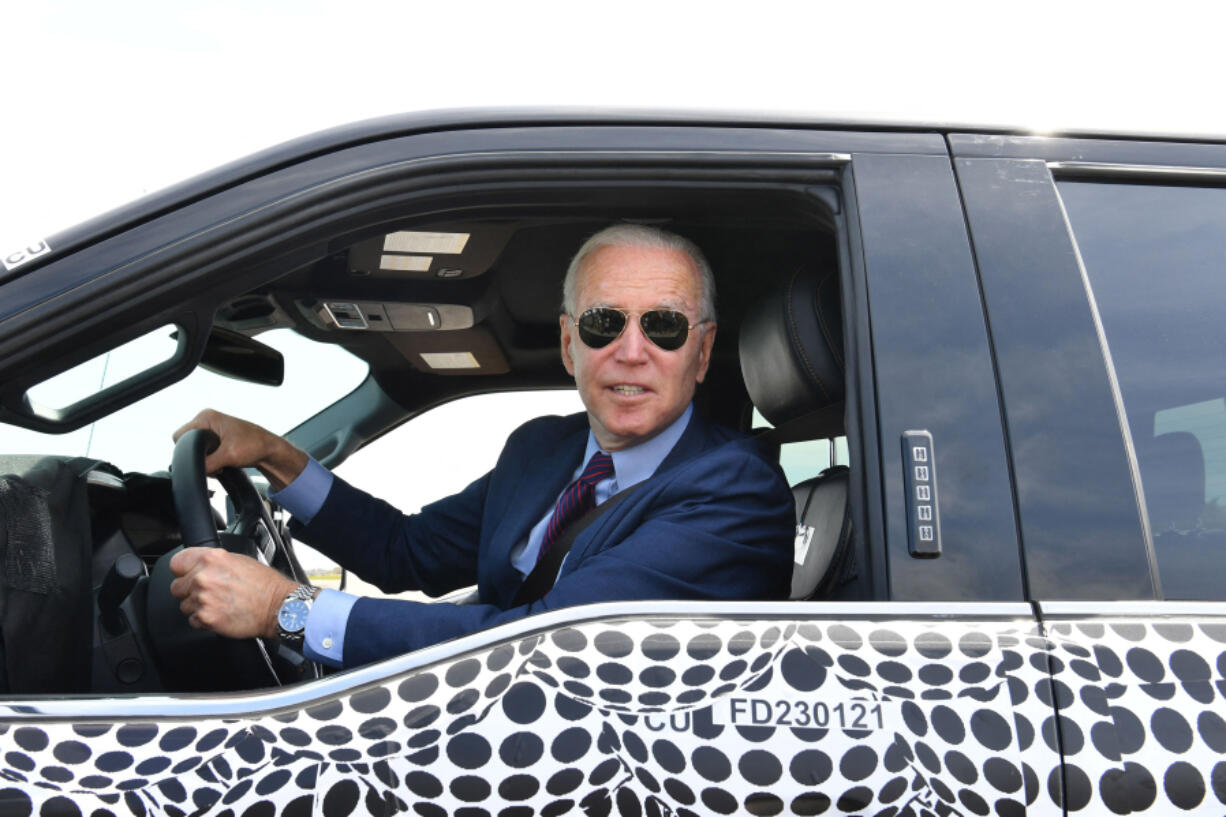 U.S. President Joe Biden drives the new electric Ford F-150 Lightning at the Ford Dearborn Development Center in Dearborn, Michigan on Tuesday, May 18, 2021.