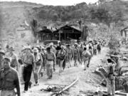 In this 1942 photo, American and Filipino prisoners of war captured by the Japanese are shown at the start of the Bataan Death March. A Vancouver High School graduate and Army chaplain, Ralph W.E. Brown, was among the prisoners. He ministered to soldiers until his death in January 1945 in a Japanese prisoner-of-war camp, and was awarded the Distinguished Service Cross.