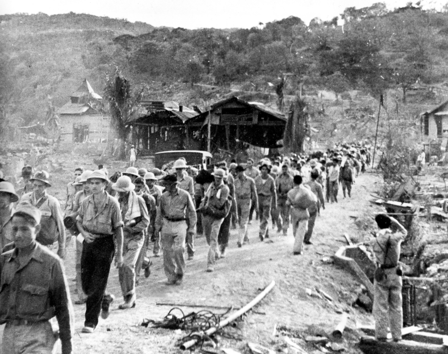 In this 1942 photo, American and Filipino prisoners of war captured by the Japanese are shown at the start of the Bataan Death March. A Vancouver High School graduate and Army chaplain, Ralph W.E. Brown, was among the prisoners. He ministered to soldiers until his death in January 1945 in a Japanese prisoner-of-war camp, and was awarded the Distinguished Service Cross.