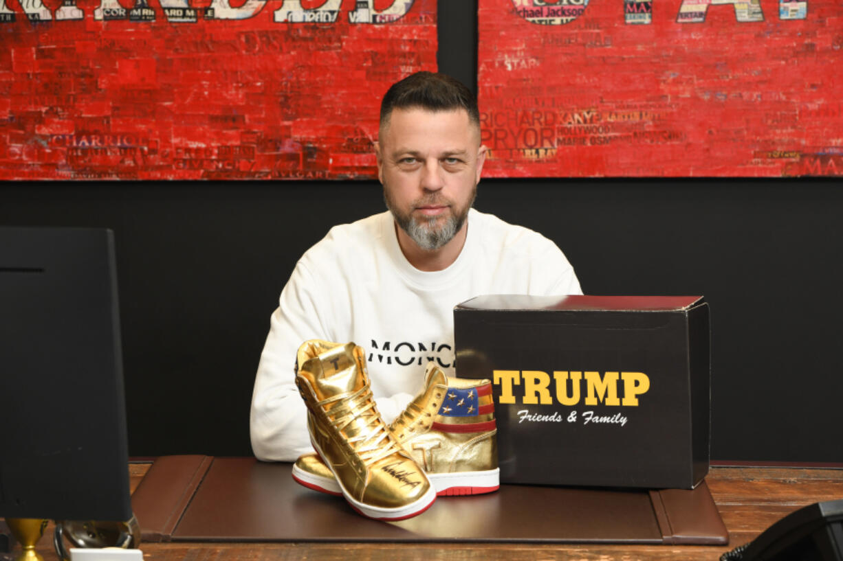 Pennsylvania resident Roman Sharf poses with his autographed Donald Trump sneakers.