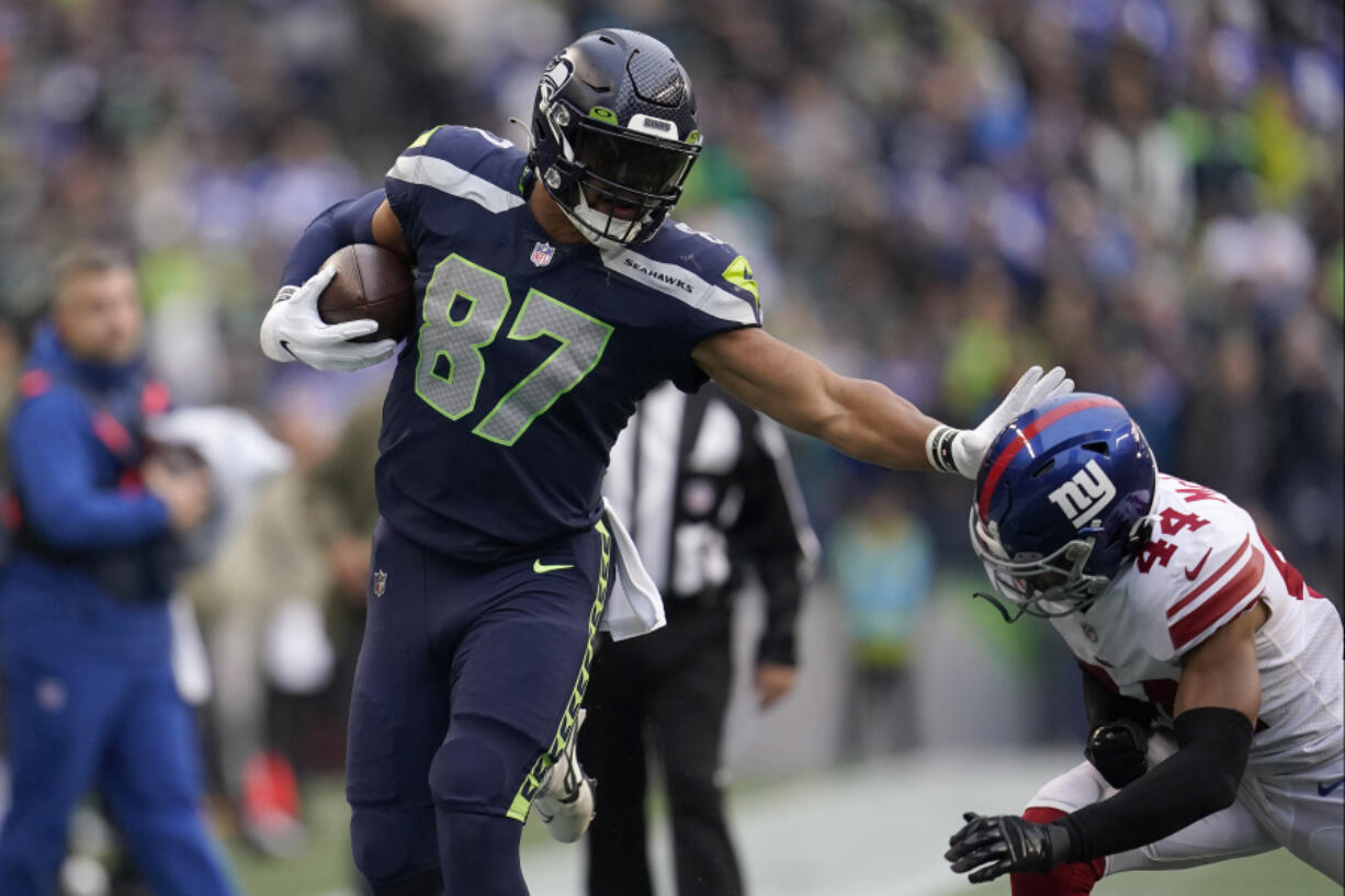 Seattle Seahawks tight end Noah Fant (87) runs against New York Giants cornerback Nick McCloud (44) during the second half of an NFL football game in Seattle, Sunday, Oct. 30, 2022.