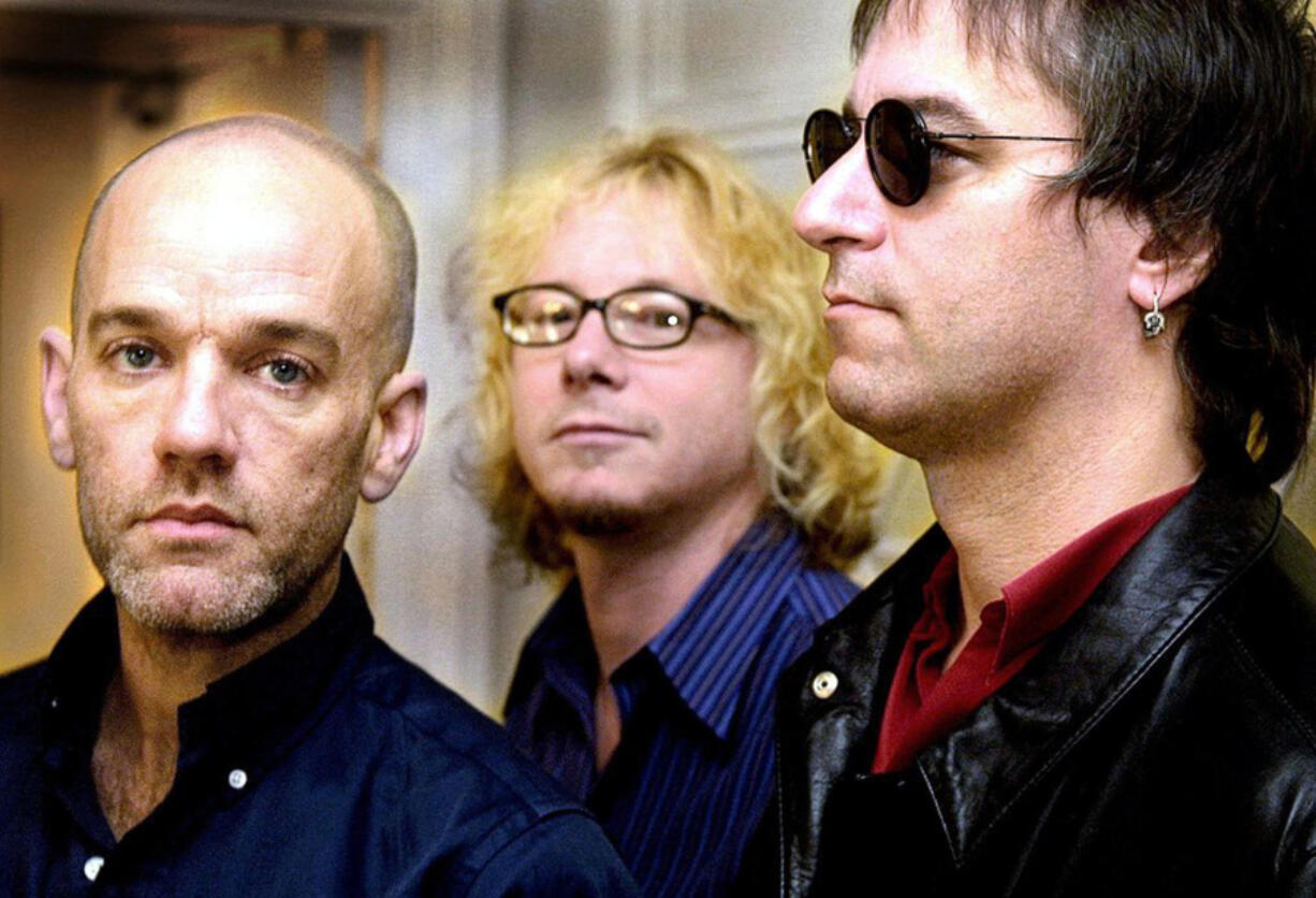 Members of the American rock group R.E.M, from left, Michael Stipe, Mike Mills and Peter Buck in London on April 27, 2001.