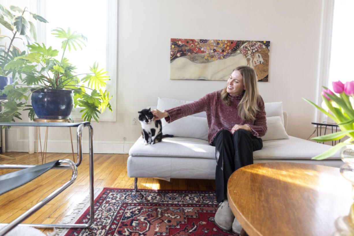 Kate Levy, 27, the renter behind the popular my.philly.home TikTok and Instagram accounts, in her Philadelphia-area apartment with her cat Tetris, 2.