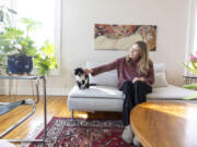 Kate Levy, 27, the renter behind the popular my.philly.home TikTok and Instagram accounts, in her Philadelphia-area apartment with her cat Tetris, 2.