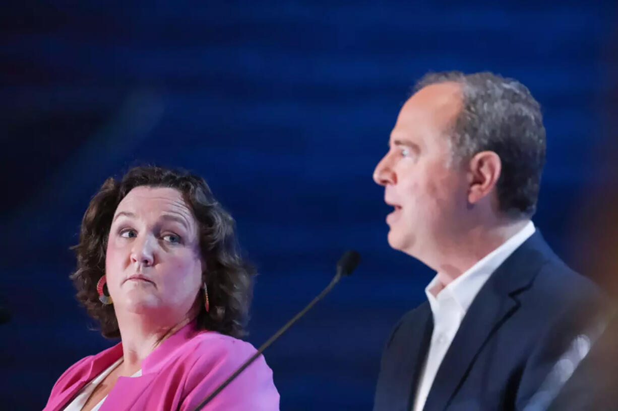 Rep. Katie Porter, left, and Rep. Adam Schiff participate in a debate on stage with other Democrats running to succeed Sen. Feinstein at Westing Bonaventure Hotel on Sunday, Oct. 8, 2023, in Los Angeles. Porter was targeted by a crypto-funded super PAC as she campaigned against Schiff in the California Senate primary.