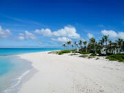 The blue sea and white sandy beaches of Grace Bay, Providenciales, Turks and Caicos.